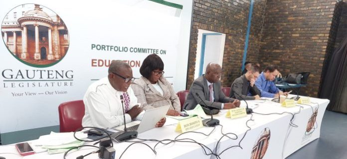 Department of Basic Education's Thabang Hlakula and members of the Gauteng provincial legislature Nthabiseng Mosito, Tshilidzi Munyai, Sergio Dos Santos and Wildri Peach at the Bela Bill public hearing in Tembisa, Ekurhuleni.