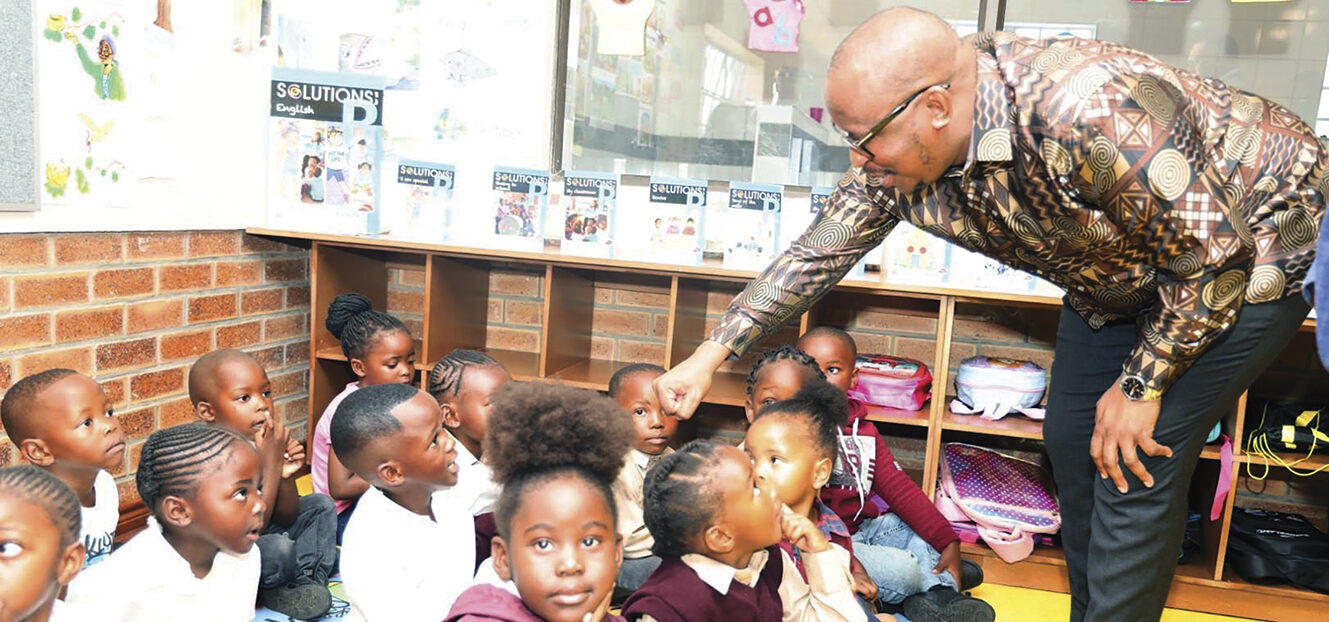 Education MEC Matome Chiloane chats with learners at Braamfischerville Primary