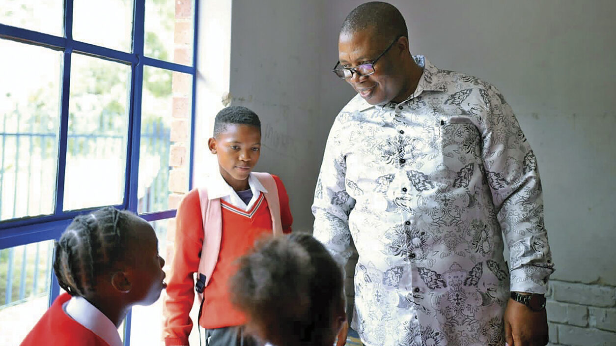 Gauteng Premier Panyaza Lesufi interacts with Raymond Mhlaba learners