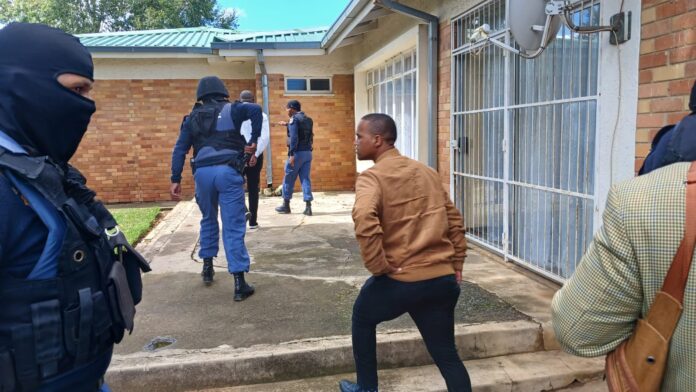 DNA evidence, dockets confiscated during raid at cop's home