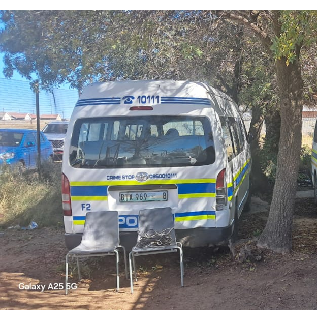 Free State cops work under trees after vacating dilapidated building