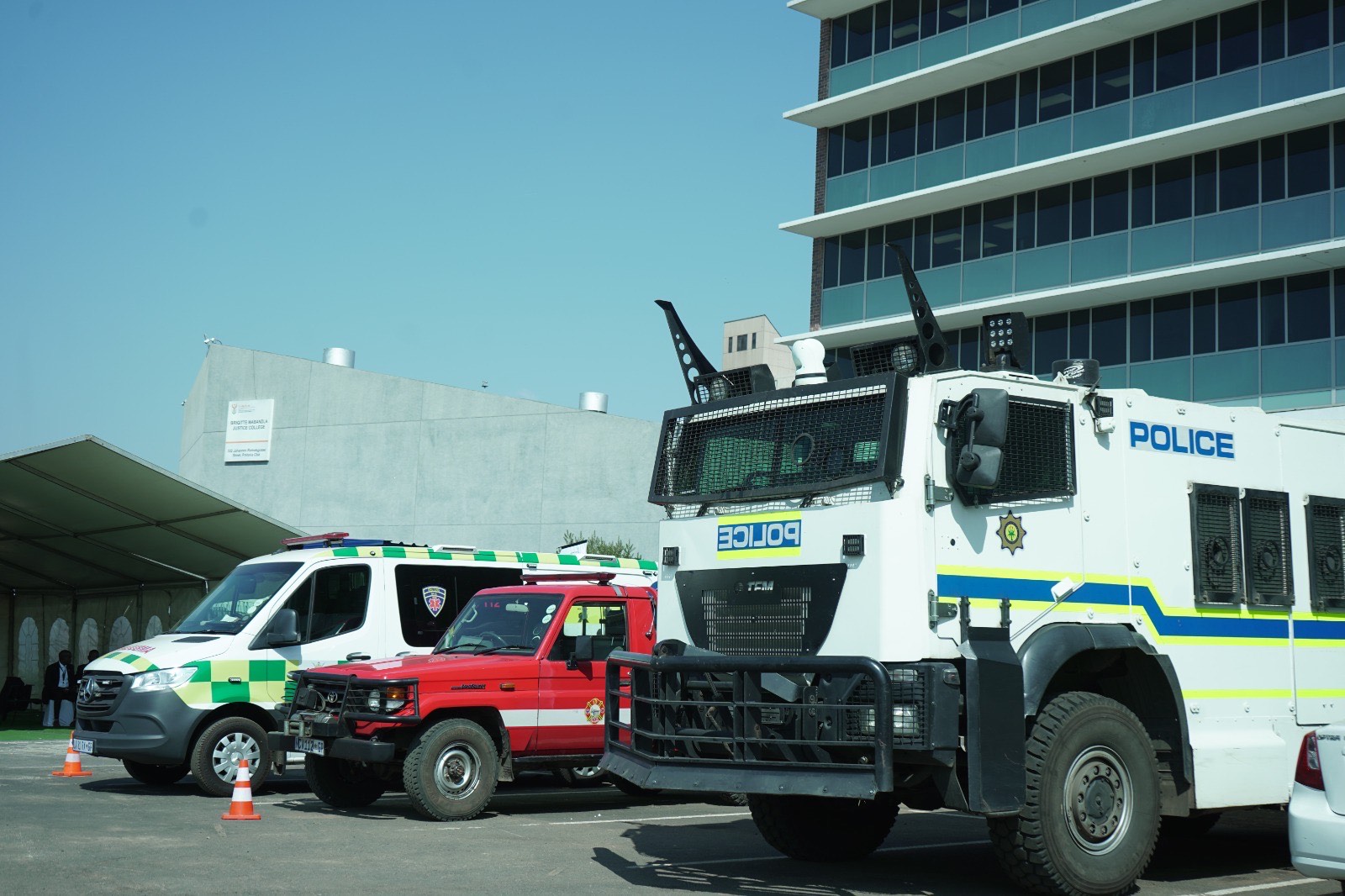 Outside the auditorium, police Nyala vehicles and paramedics stand on alert, a visible reminder of the security and preparedness required for high-profile judicial inquiries.