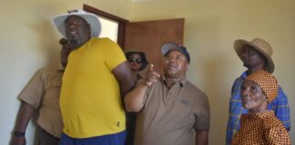 MEC of Cogta and human settlements Saki Mokoena alongside the new home owner and his team in one of the houses his department had handed over to beneficiaries in Namahadi Frankfort in Free State