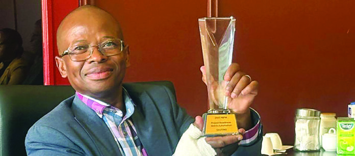 DID Head of Department: Mr Rufus Mmutlana holding the Batho Pele Award