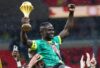 Sadio Mane with the AFCON trophy.