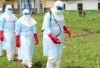Health workers arrive at a treatment centre to conduct disinfection drills in Rwampara, Democratic Republic of the Congo