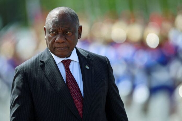 South Africa's President Cyril Ramaphosa reviews an honour guard while meeting Brazil's President Luiz Inacio Lula da Silva.