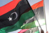 FILE PHOTO: People wave Libyan flags during a demonstration in Benghazi