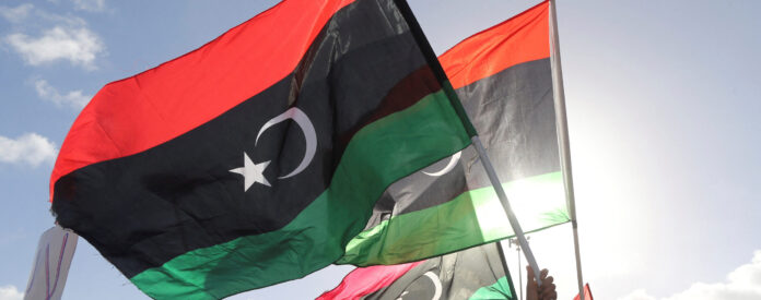 FILE PHOTO: People wave Libyan flags during a demonstration in Benghazi