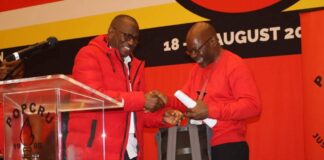 Popcru's Thulani Ngwenya and SACP's Solly Mapaila at the POPCRU CEC meeting.