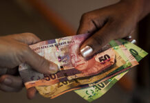 Two sectors that are leading South Africa in salary increases Money exchanging hands