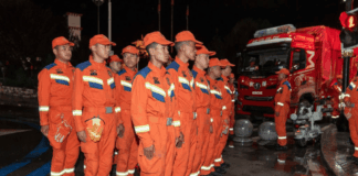 Rescuers prepare before heading to the mudslide-stricken Gyirong Port in Gyirong County, southwest China's Xizang Autonomous Region, Aug. 27, 2026.