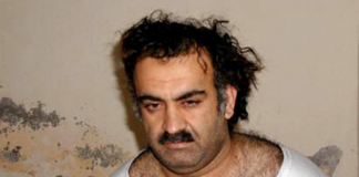 Khalid Sheikh Mohammed after his capture in March 2003, showing him in a simple shirt.