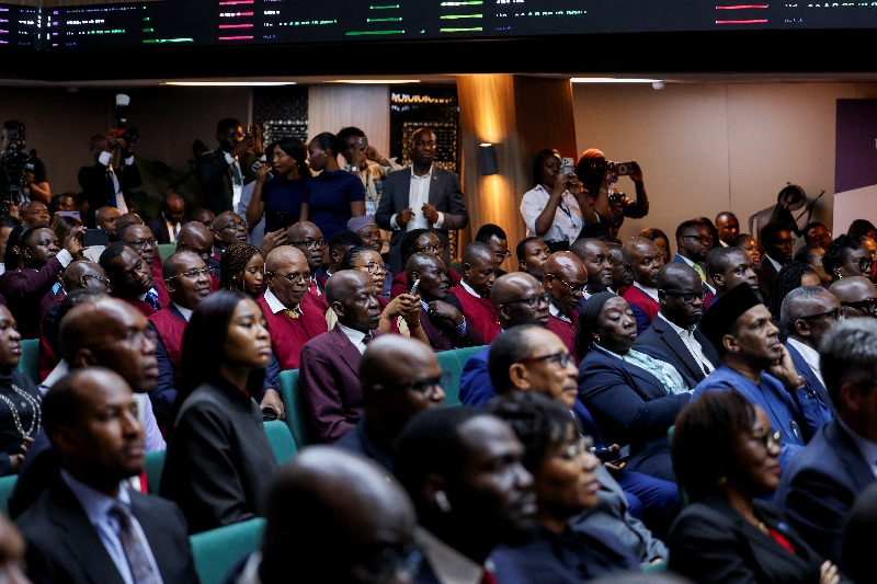 Aliko Dangote holding a gavel at the Dangote Refinery IPO opening in Lagos.