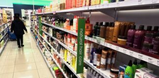 Hardware retailers struggling despite stronger consumer spending Worker walking past an aisle of hair products at a Clicks store in Johannesburg