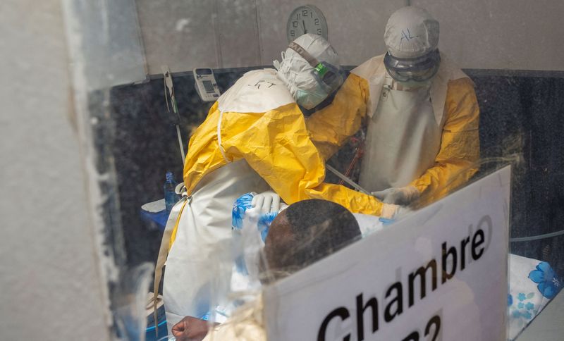 Medecins Sans Frontieres doctors treat a patient inside the Kitatumba Ebola treatment center in Butembo, North Kivu province.
