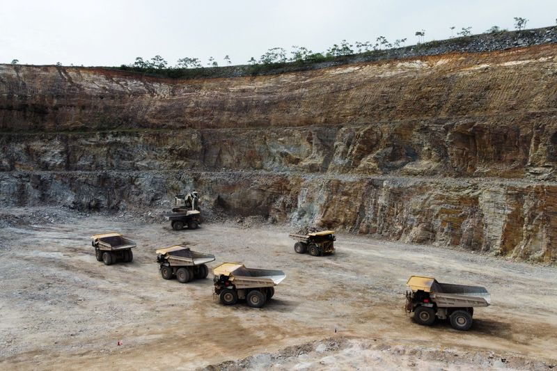 Dump trucks queued at Gold Fields Mine in Tarkwa, Ghana
