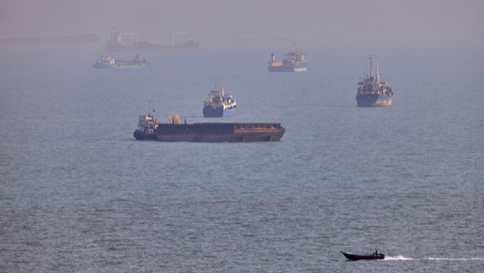 Commercial vessels seen anchored in the Strait of Hormuz off Bandar Abbas, Iran, August 5, 2026. /VCG