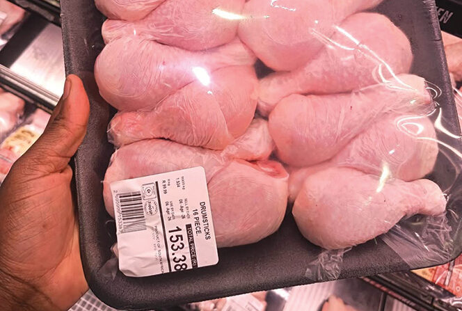 Packaged chicken portions displayed in a retail store representing rising staple food costs in South Africa.