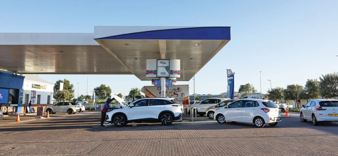 Motorists queuing at a Cape Town petrol station ahead of a major fuel price increase.