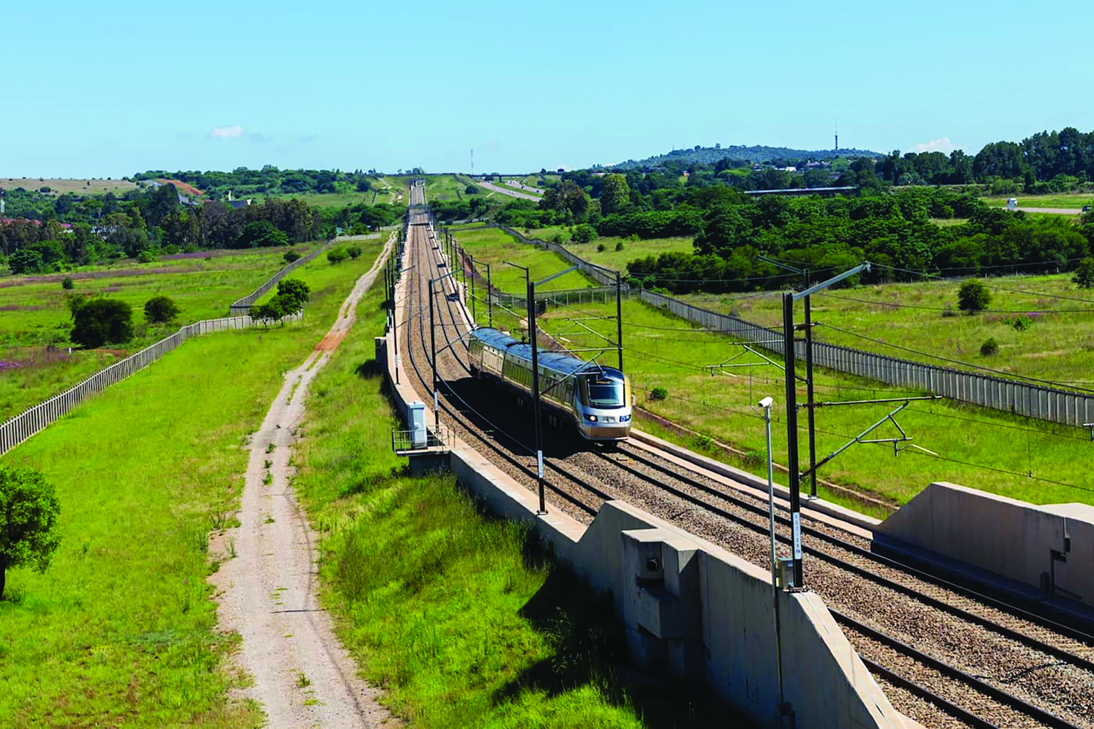 Advancing Gauteng’s G13 priorities A Gautrain train moving along the track in Gauteng as part of provincial public transport infrastructure.