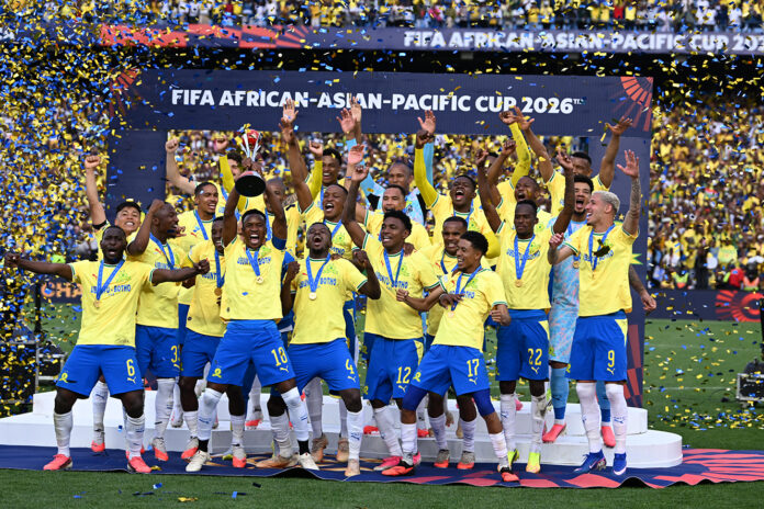 Mamelodi Sundowns players celebrate with the trophy at Loftus Versfeld Stadium after defeating Al Ahli