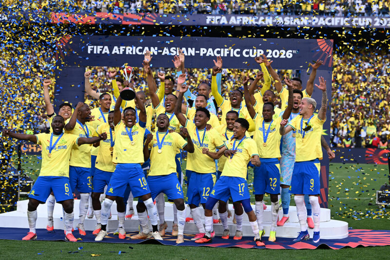 Mamelodi Sundowns players celebrate with the trophy at Loftus Versfeld Stadium after defeating Al Ahli