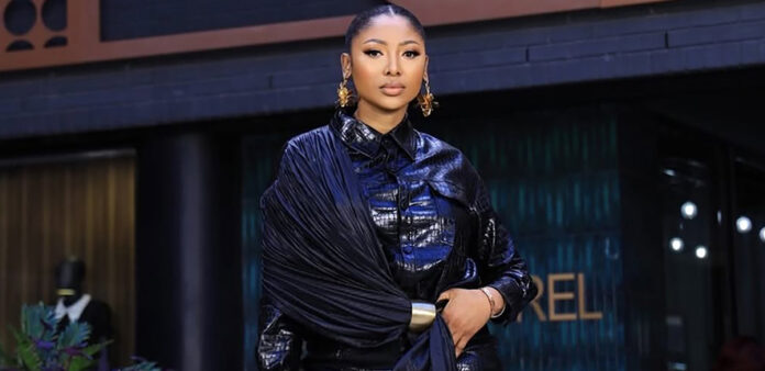 Actress and media personality Enhle Mbali Mlotshwa posing for a portrait.