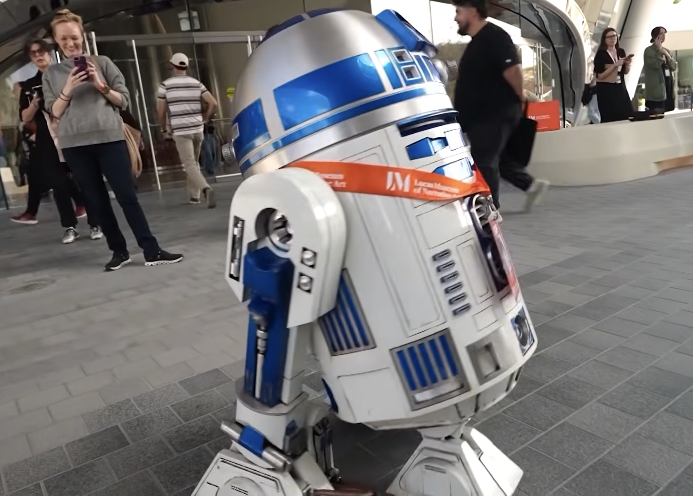 R2D2 entertaining visitors at the opening of George Lucas' new museum.