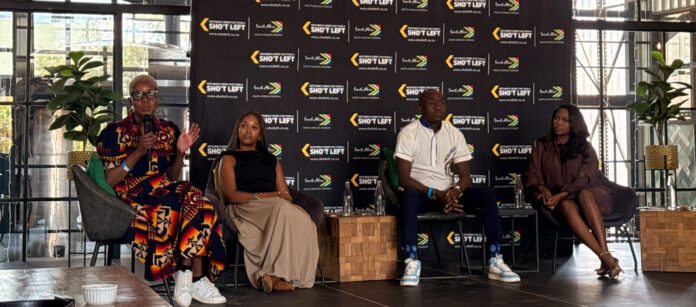 Alt text: Mashoto Mokgethi speaking about domestic tourism affordability at The Great Debate in Pretoria