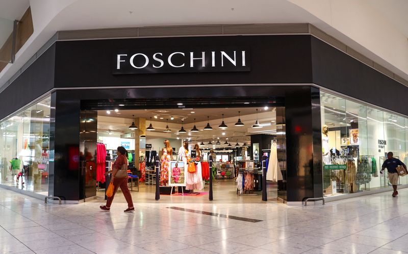 A shopper walks past a Foschini store at a shopping centre in Johannesburg, South Africa, November 11, 2022. REUTERS/Siphiwe Sibeko