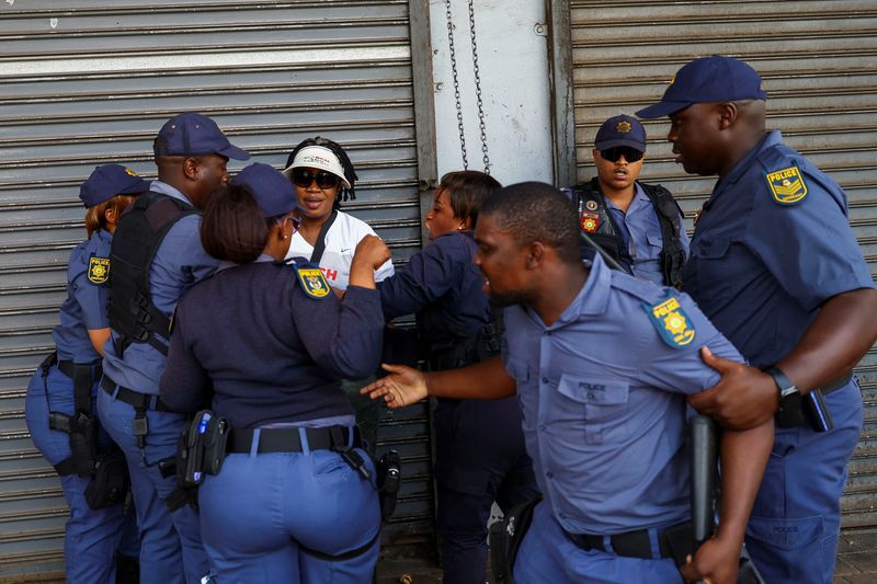 Ramaphosa deploys troops to KZN to help control anti-migrant protests Police officers detain a protester during a march following anti-migrant unrest in Johannesburg's Soweto township and the coastal city of Durban, where vehicles were torched and foreign-owned shops were looted, in Johannesburg, South Africa, October 9, 2026. REUTERS/Siphiwe Sibeko